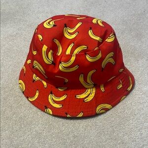 Reversible Bucket Hat with Red Banana Print and Solid Black.